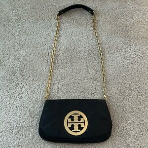 Tory Burch black leather crossbody clutch with detachable gold chain